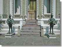 Statue with human body and bird wing and feet