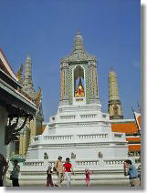 Golden Buddha reflects on the white seat